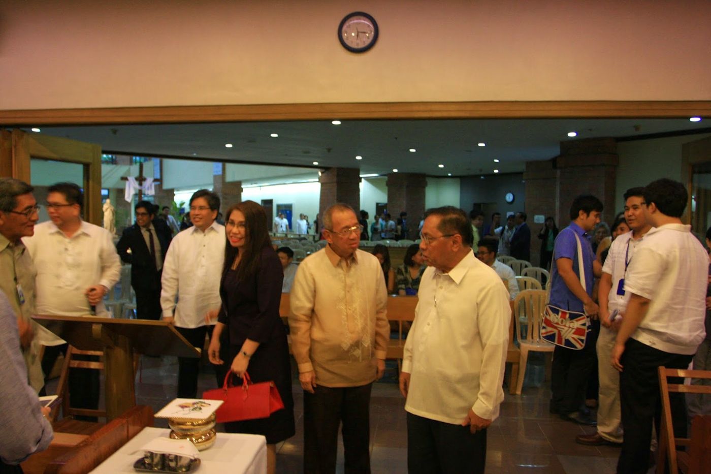 Guests standing at the Red Mass in the law school chapel